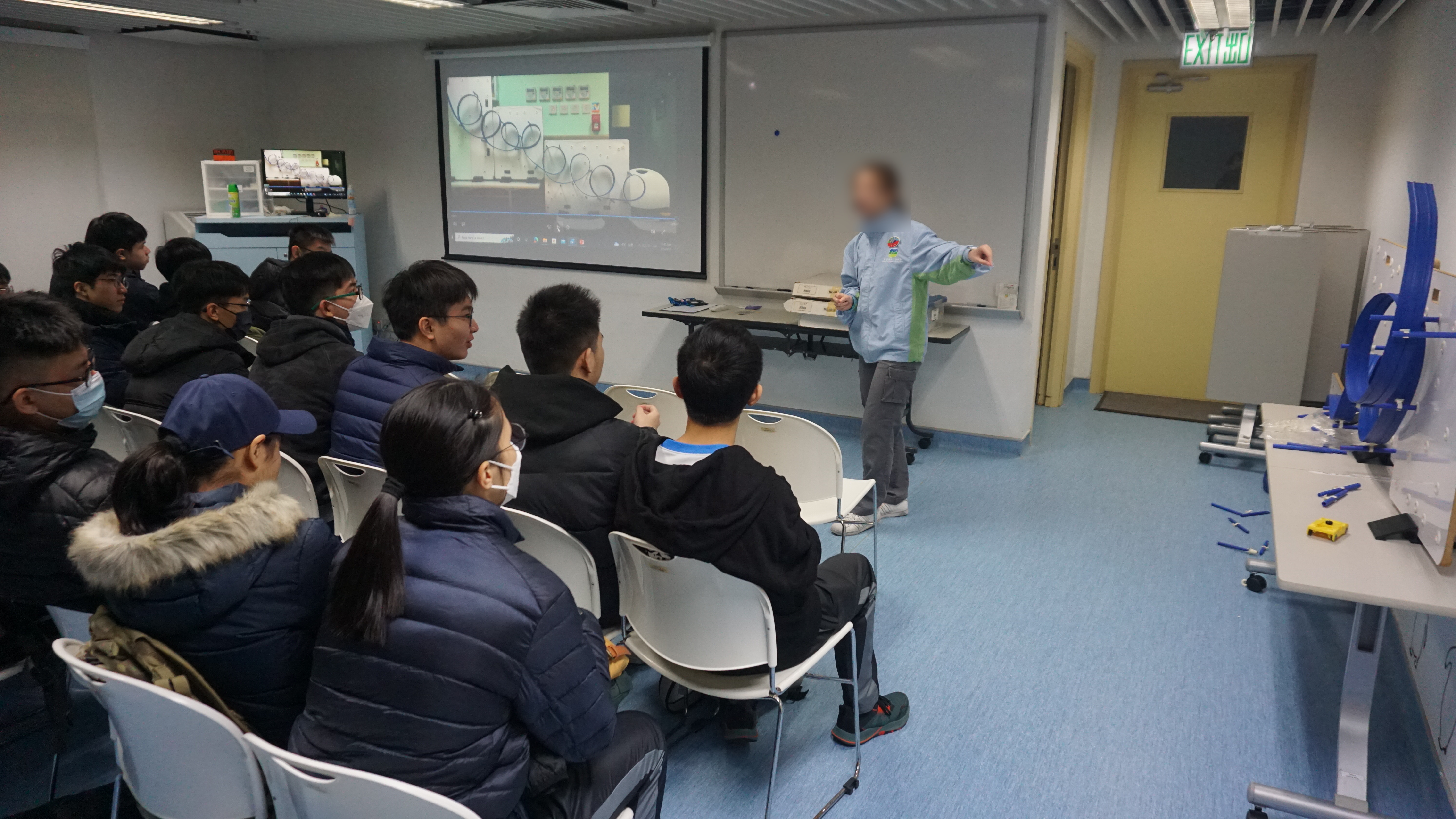 Debriefing on the roller coaster tracks made by the students